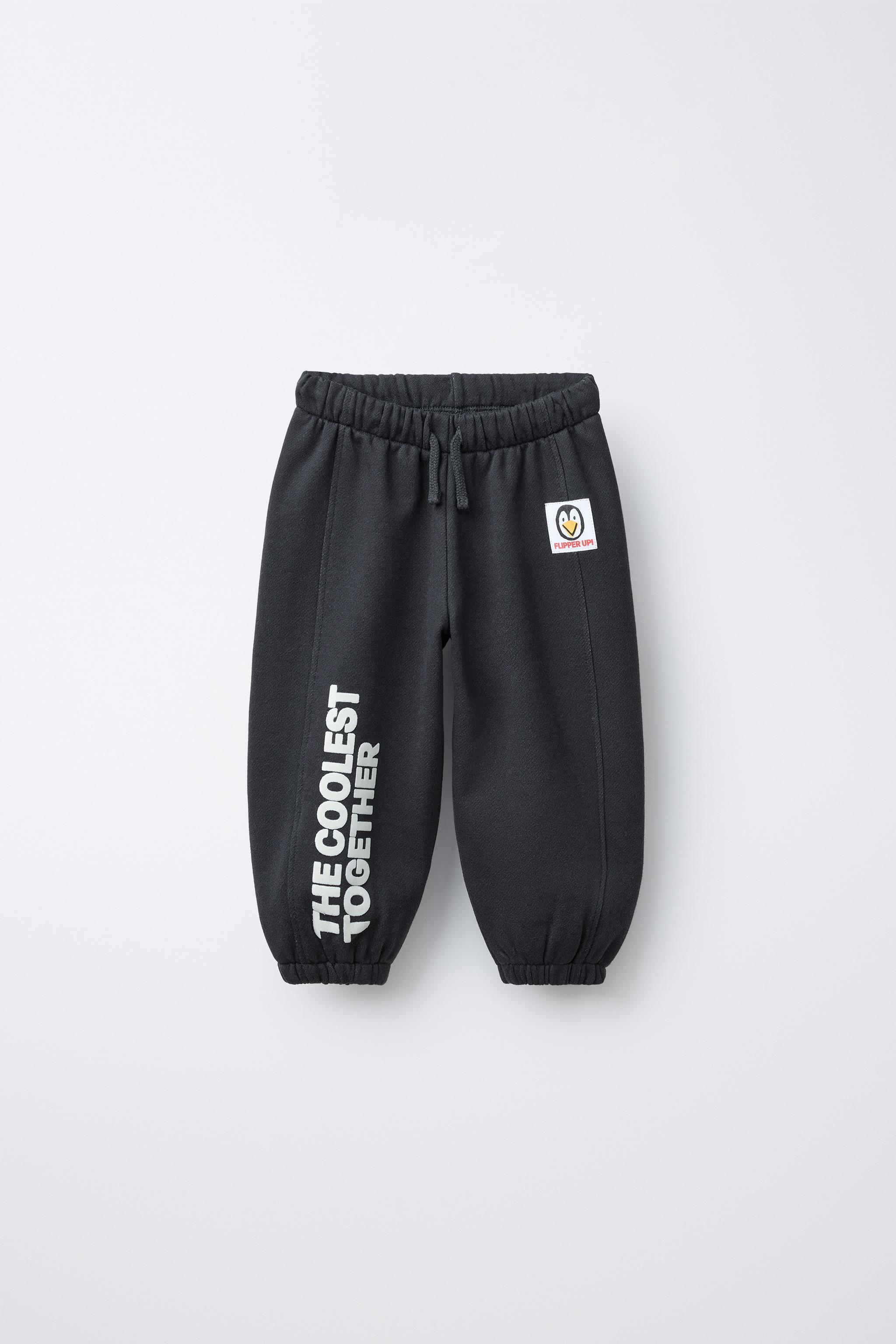 PANTALON JOGGER INSCRIPTION FLOCK